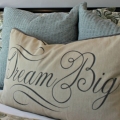 pillow with dream big wording staging