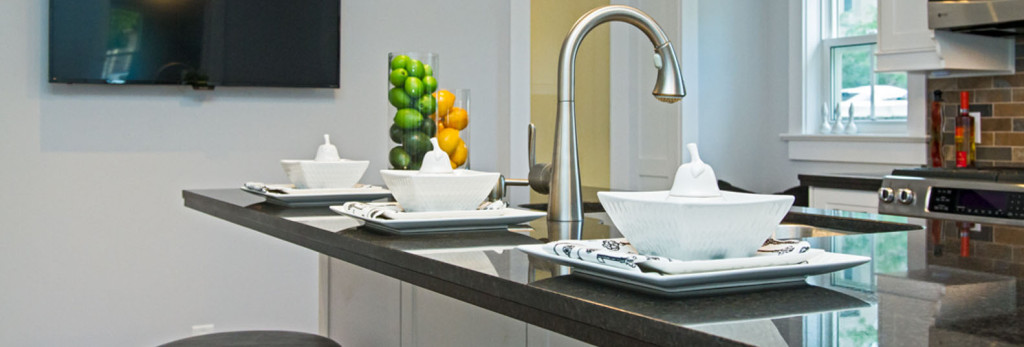 Kitchen island with plates and decor added - staged